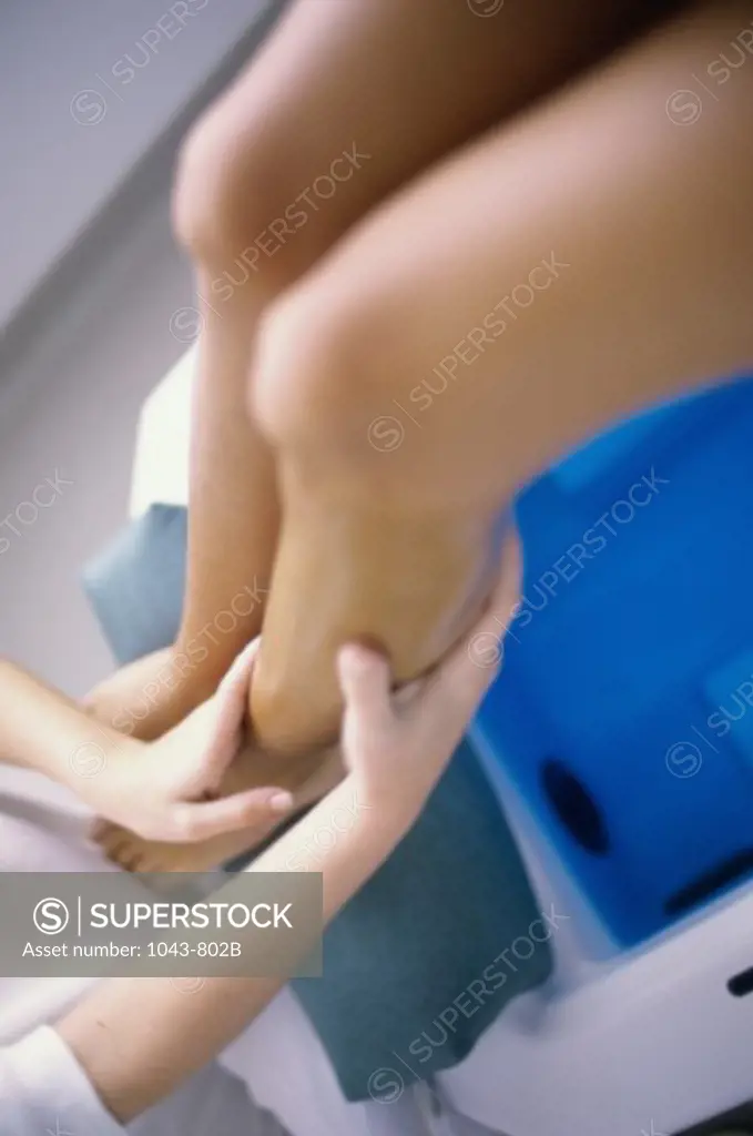 Young woman getting a leg massage