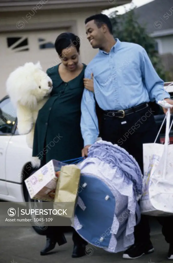 Husband walking with his pregnant wife