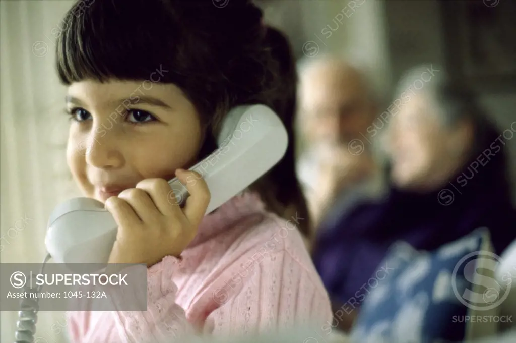 Girl talking on a telephone