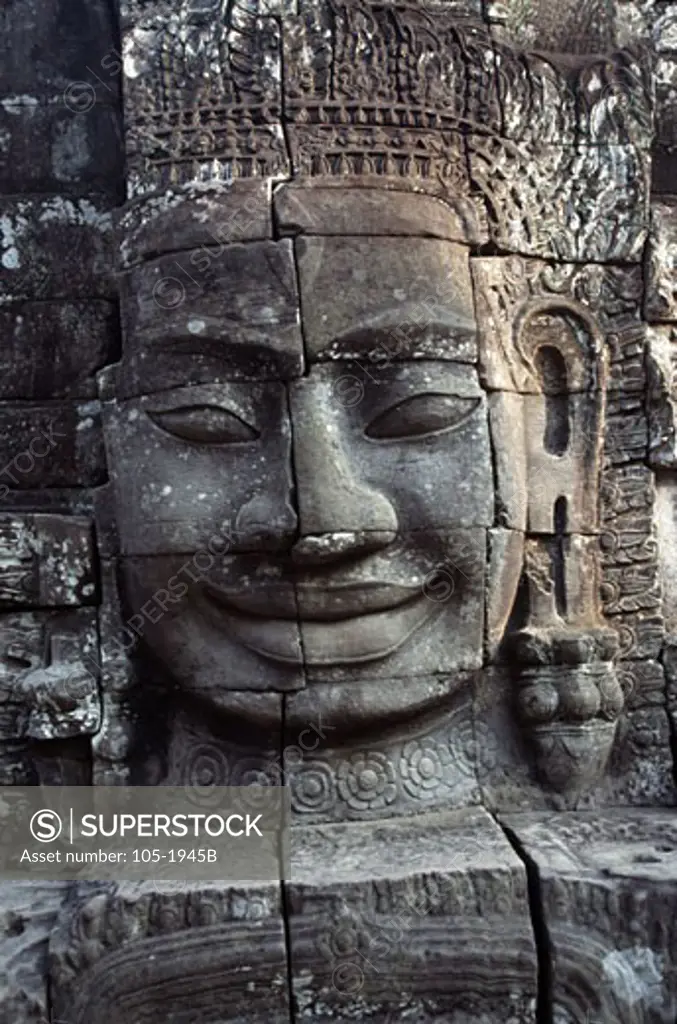 Details of the face of Avalokiteshvara in a temple, Bayon Temple, Angkor Thom, Cambodia