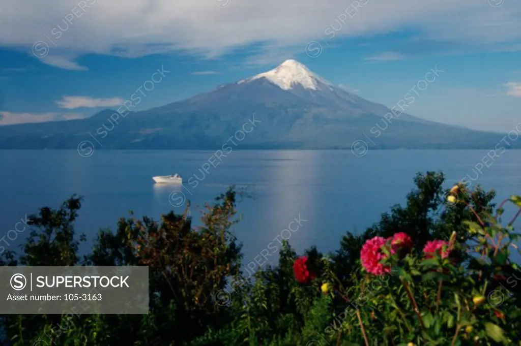 Boat in a lake with a mountain in the background, Llanquihue Lake, Osorno Volcano, Chile