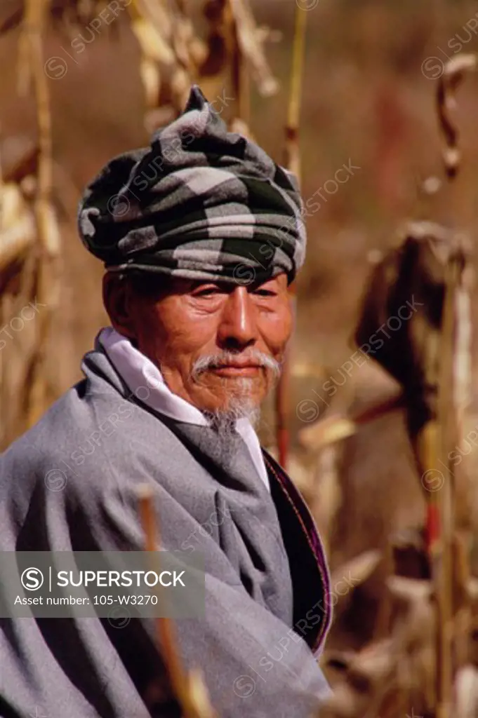 Portrait of a mature man in traditional clothing, Thimphu, Bhutan