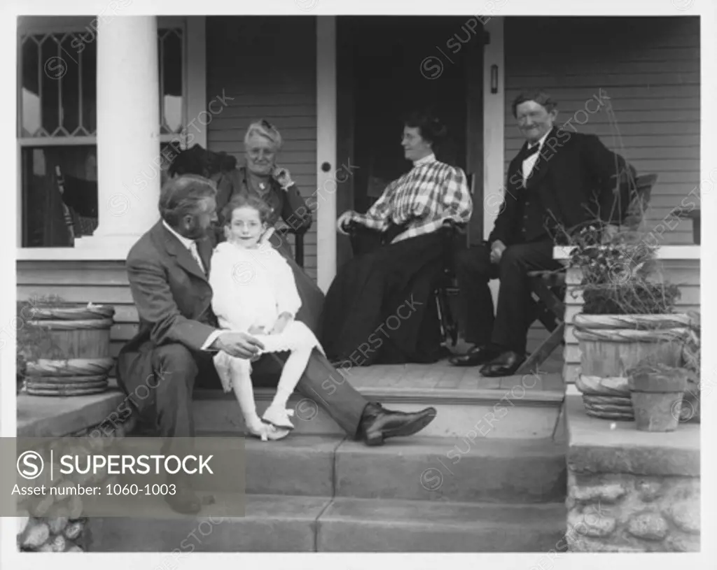 FERDINAND ELLERMAN ON STEPS OF HOUSE WITH FAMILY?.