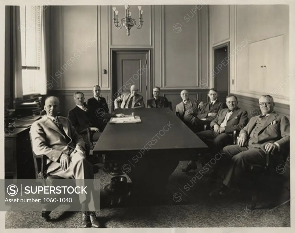 GROUP PHOTO OF BOARD OF DIRECTORS OF PASADENA IN CONFERENCE ROOM; PAUL MERRILL THIRD FROM RIGHT.