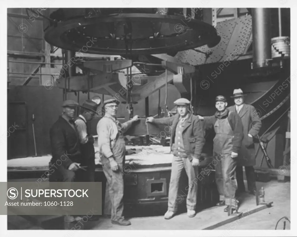 LIFTING DEVICE FOR REMOVING 100-INCH MIRROR FROM ITS CELL READY TO BE LOWERED ONTO MIRROR (L-R: BEEBE, DALTON, GLENN, MOORE, NELSON, PEASE).