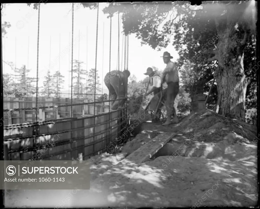 CONSTRUCTING WALLS FOR LARGE WATER RESERVOIR ON MT. WILSON.