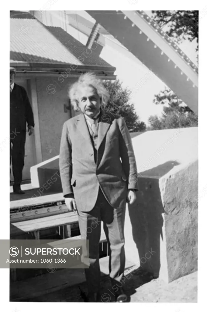 ALBERT EINSTEIN ON THE STEPS OUTSIDE THE 150-FOOT TOWER TELESCOPE.