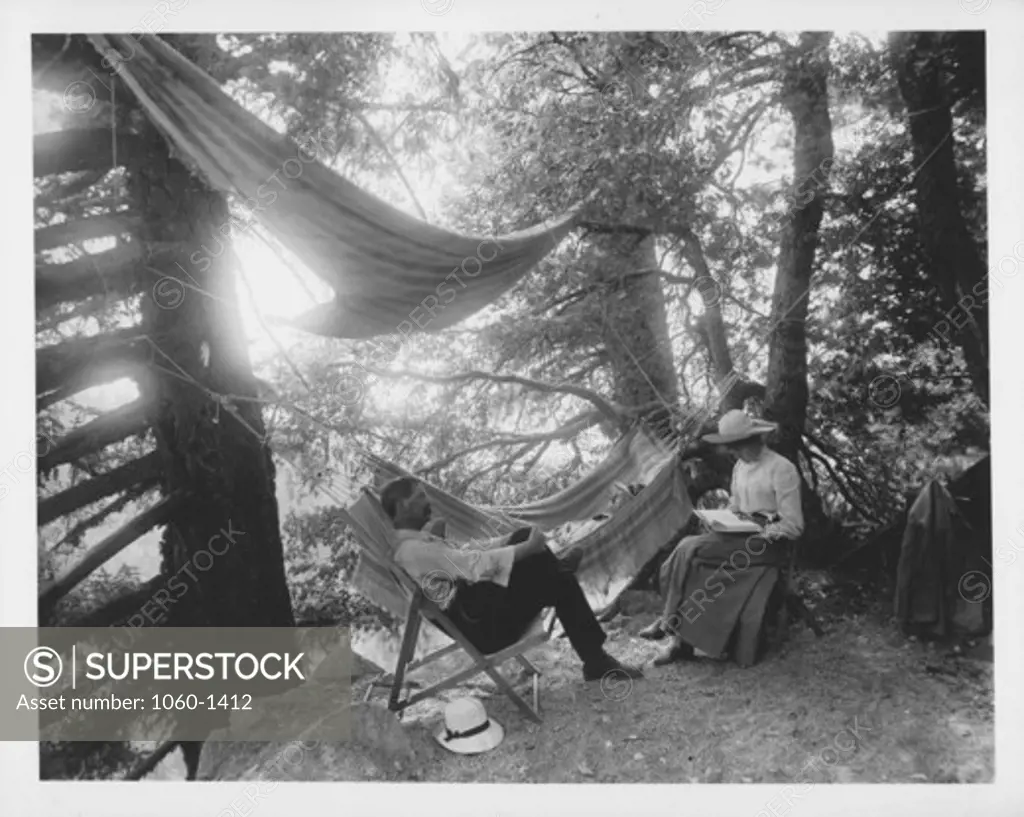 GEORGE HALE RELAXING IN HAMMOCK ON MT. WILSON, BEING KEPT COMPANY BY H. H. & MRS. TURNER.