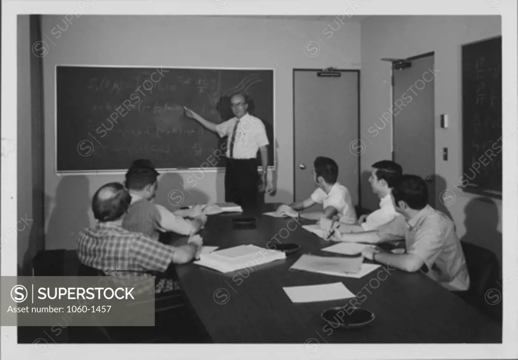 ROBERT HOWARD TEACHING CALTECH GRADUATE STUDENTS IN CONFERENCE ROOM OF NEW WING OF OBSERVATORY OFFICE BUILDING.