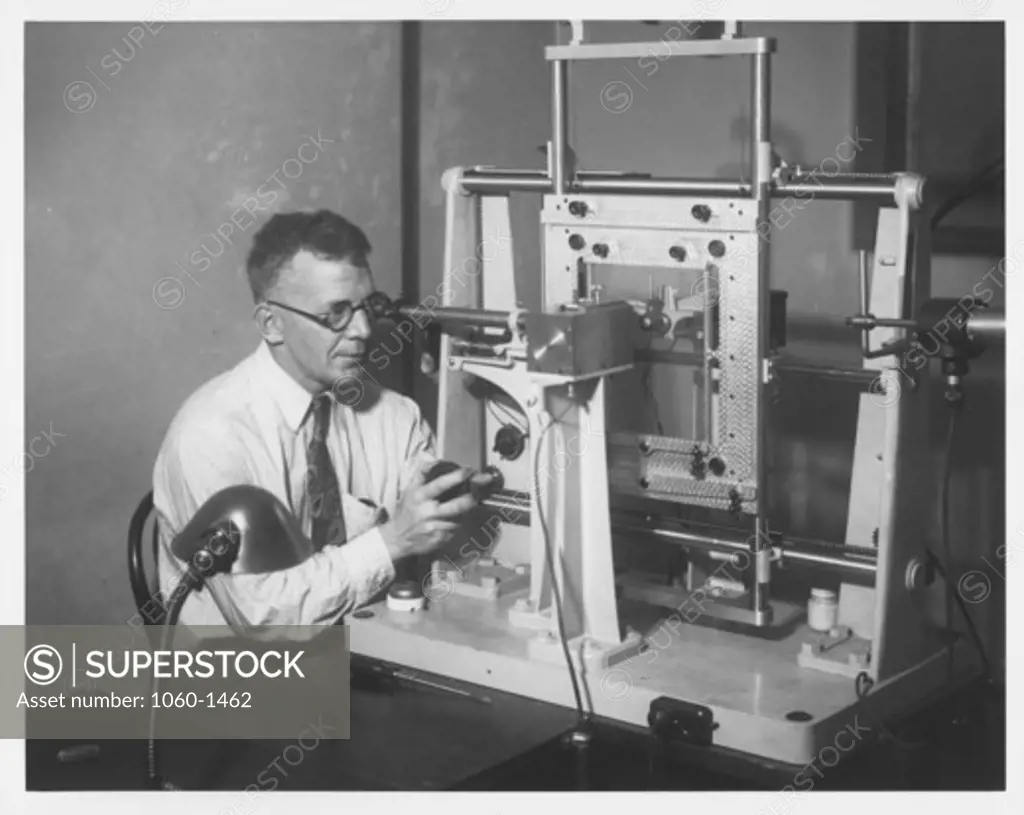 WILLIAM H. CHRISTIE AT MICROPHOTOMETER.