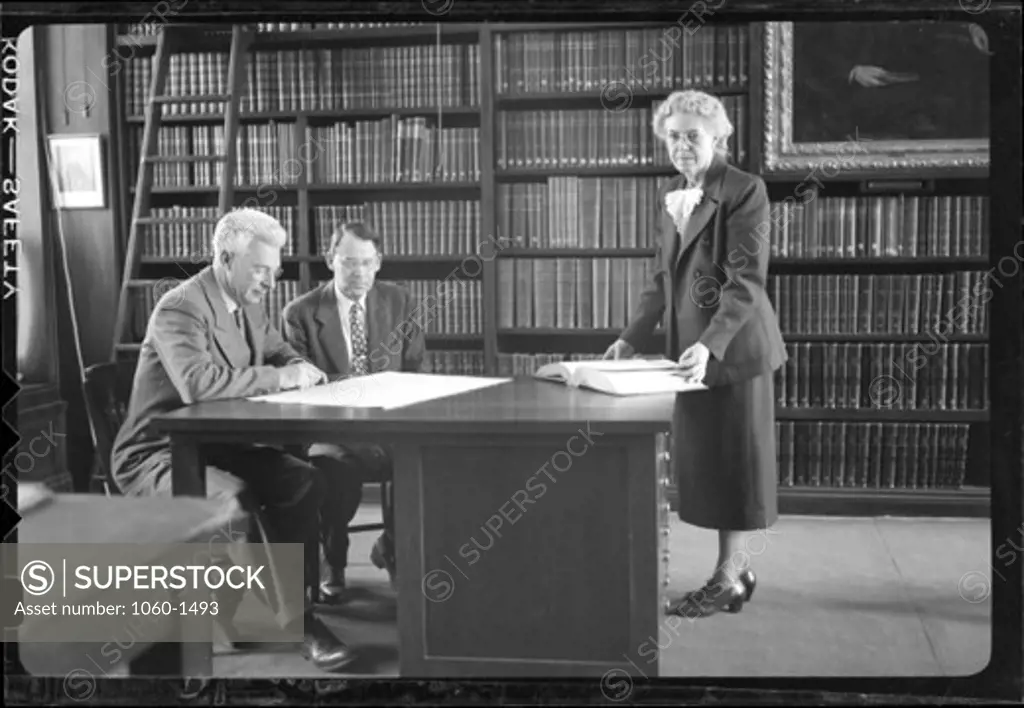 (L TO R): ELIZABETH CONNOR, PAUL MERRILL, AND SETH NICHOLSON IN THE HALE LIBRARY.