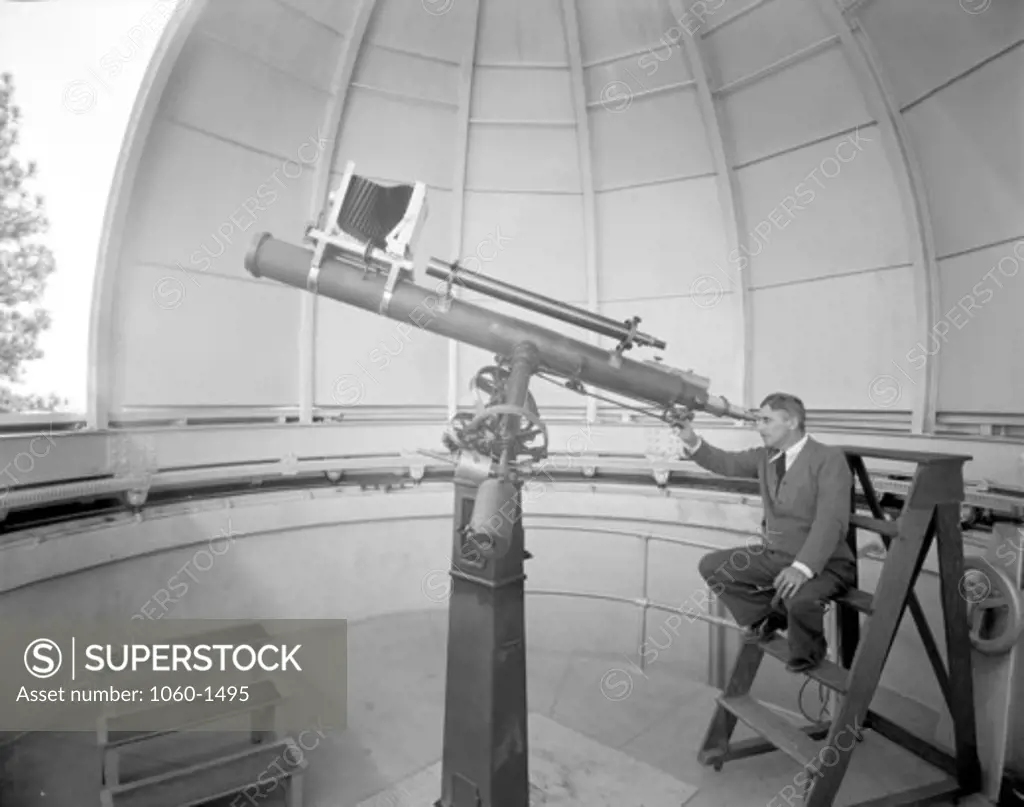 ANTHONY WAUSNACK LOOKING THROUGH THE 6-INCH TELESCOPE ON MT. WILSON.