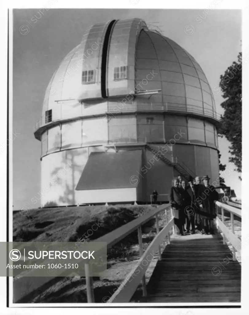 (L to R): Albert Einstein, Edwin P. Hubble, Walther Mayer, Walter S. Adams, Arthur S. King, & William W. Campbell on the footbridge leading to the 100"" telescope dome (in the background)