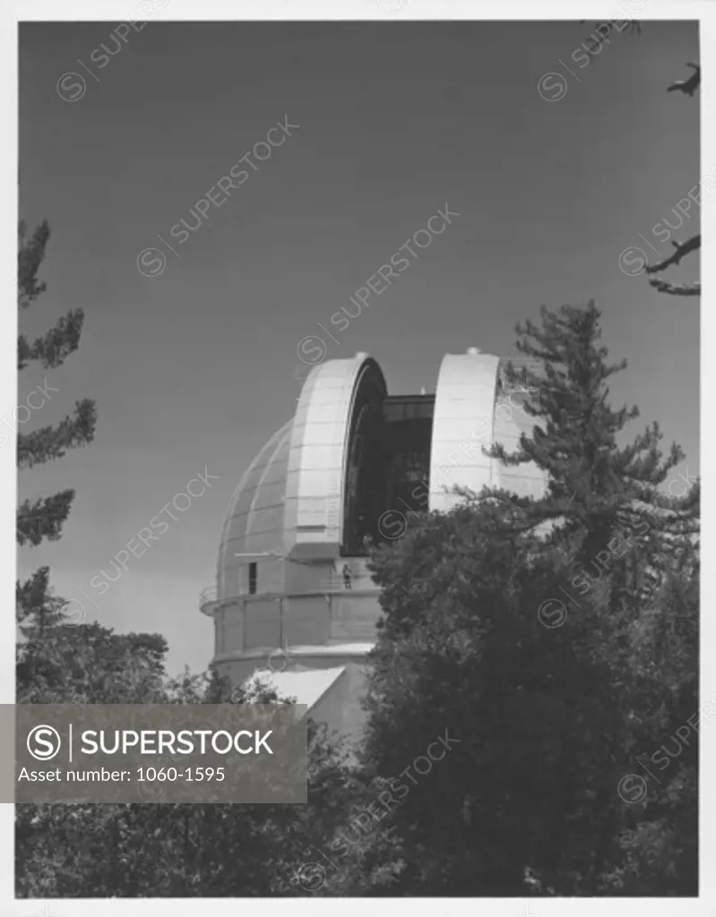 100-INCH TELESCOPE DOME AS SEEN FROM THE SOUTHEAST, SHUTTERS OPEN, JOE HICKOX VISIBLE ON CATWALK & NELSON IN SHUTTER.