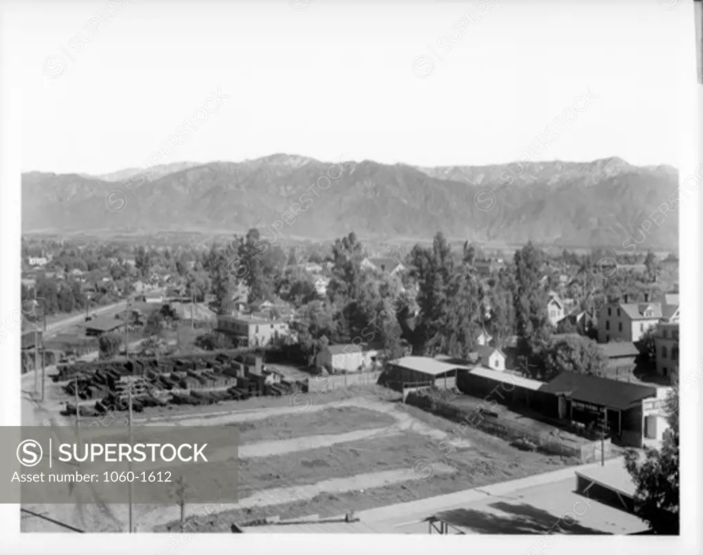 HISTORICAL VIEW OF PASADENA FROM CHAMBER OF COMMERCE:   OUR FEED & FUEL CO.; MT. WILSON IN RIGHT BACKGROUND.