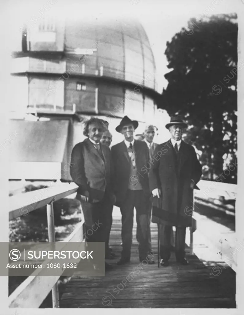 (L TO R): ALBERT EINSTEIN, WALTHER MAYER, WALTER ADAMS, ARTHUR KING, & WILLIAM CAMPBELL ON THE FOOTBRIDGE NEAR THE 100-INCH TELESCOPE DOME.