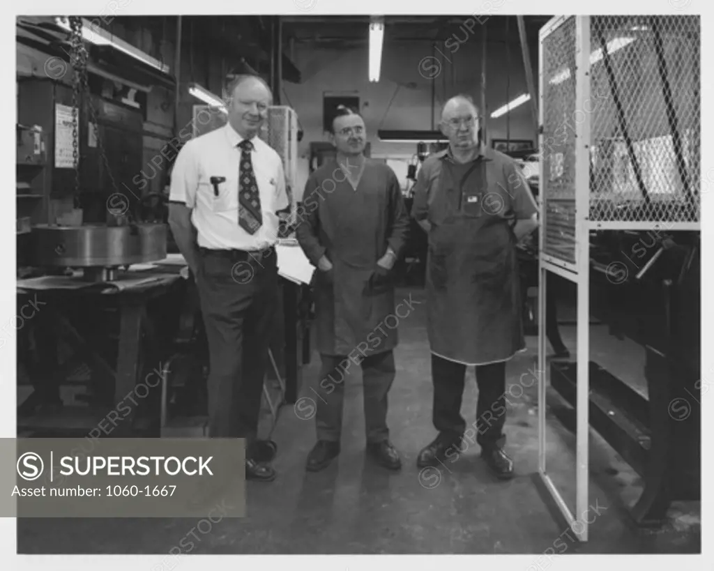 (L TO R): RUDOLF RIBBENS, STEPHEN DORO, & FRED O'NEILL IN THE MACHINE SHOP.