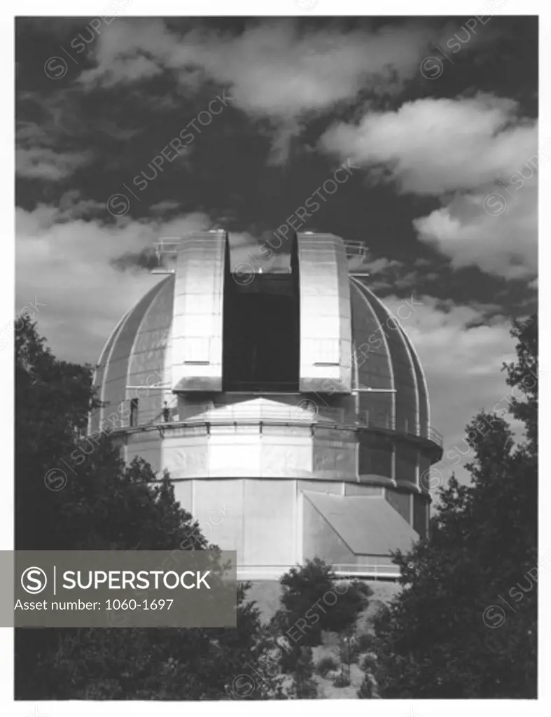 100-INCH TELESCOPE DOME AS SEEN FROM THE SOUTHWEST, SHUTTERS OPEN, MAN VISIBLE ON CATWALK.