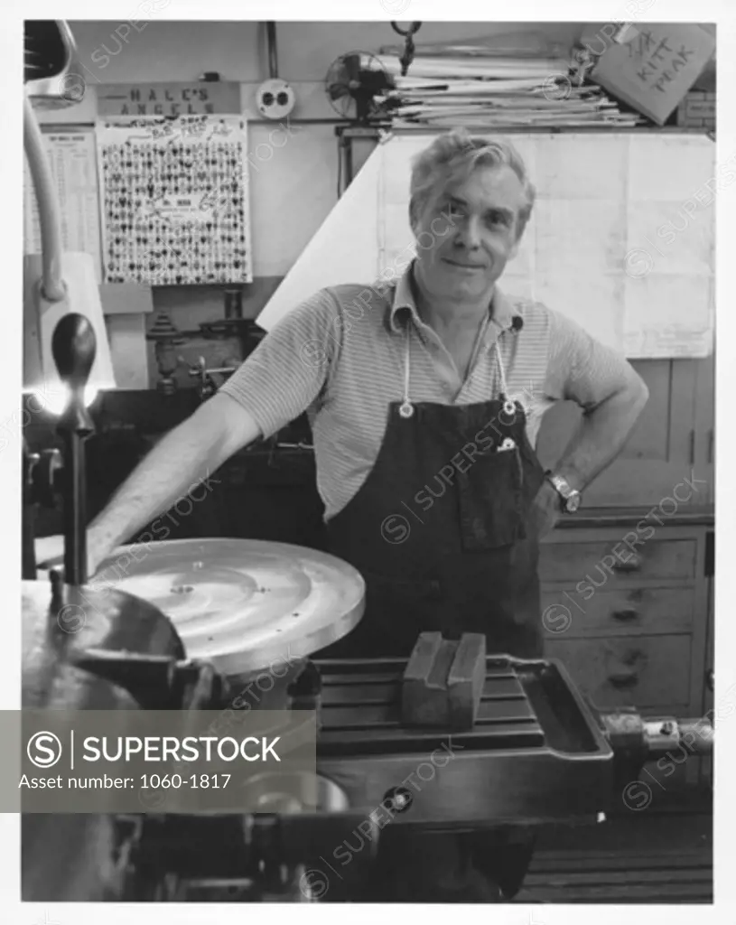PHOTO OF ROBERT GEORGEN IN THE MACHINE SHOP.