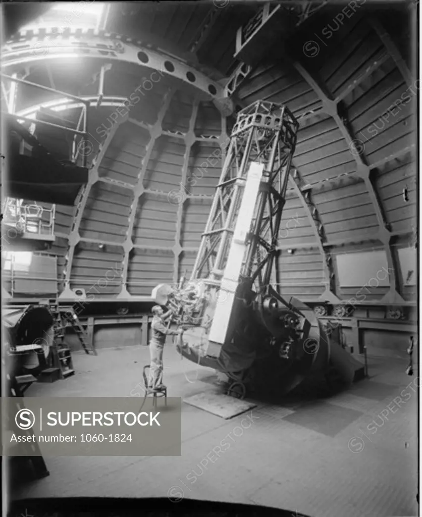 JOE HICKOX AT THE 60-INCH TELESCOPE.  PETTIT & SLOCUM LIGHT CAMERA ATTACHED TO TELESCOPE.
