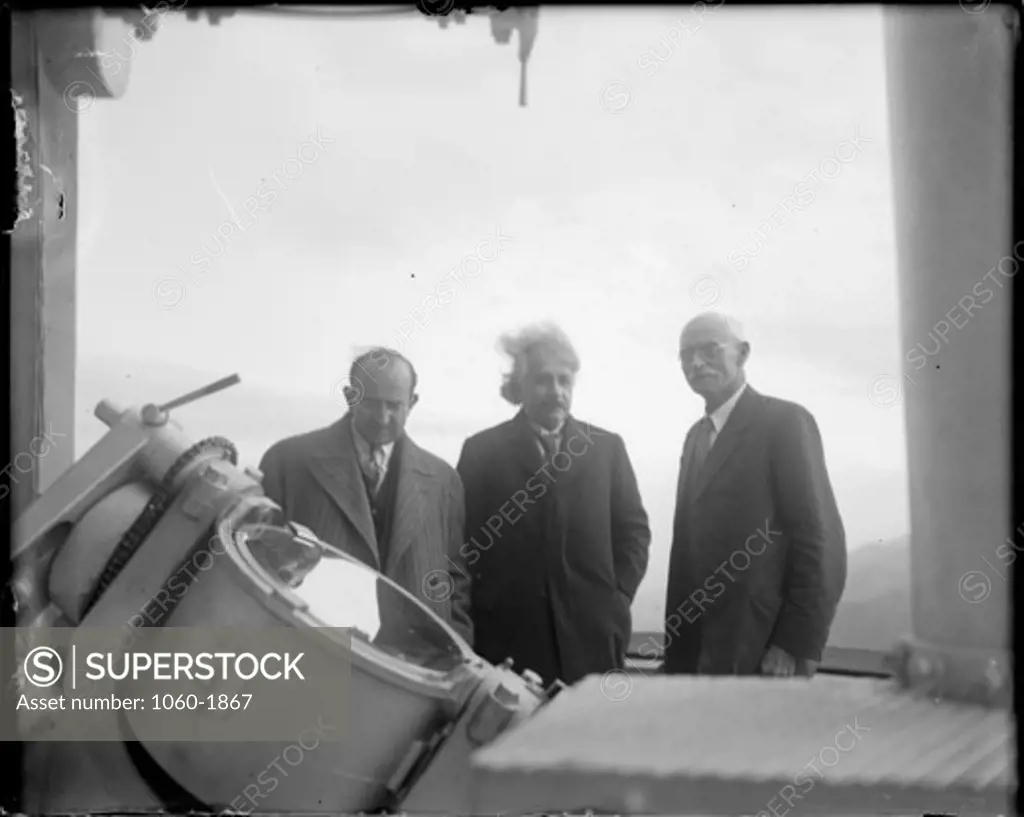 (L TO R): WALTHER MAYER, ALBERT EINSTEIN, & CHARLES ST. JOHN AT THE COELOSTAT AT THE TOP OF THE 150-FOOT TOWER TELESCOPE.