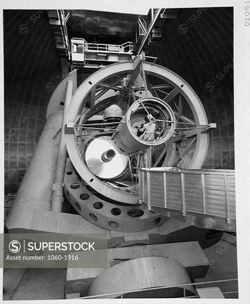 200-INCH TELESCOPE FROM THE SOUTH, TUBE DOWN, OBSERVER IN PRIME-FOCUS CAGE, MIRROR OPEN.