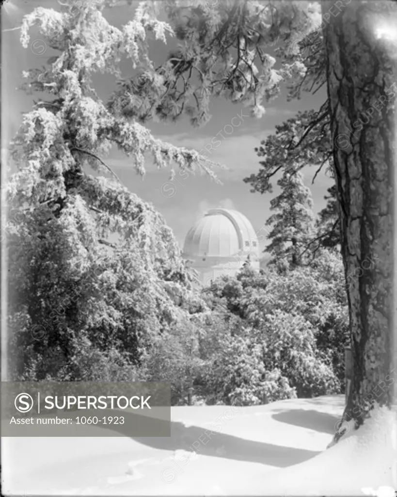 100-INCH TELESCOPE DOME SEEN IN THE DISTANCE AFTER A HEAVY SNOWFALL.