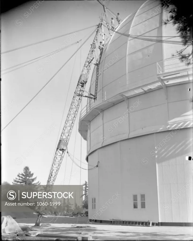 PAINTING THE 100-INCH TELESCOPE DOME; PORTION OF STRUCTURE VISIBLE.