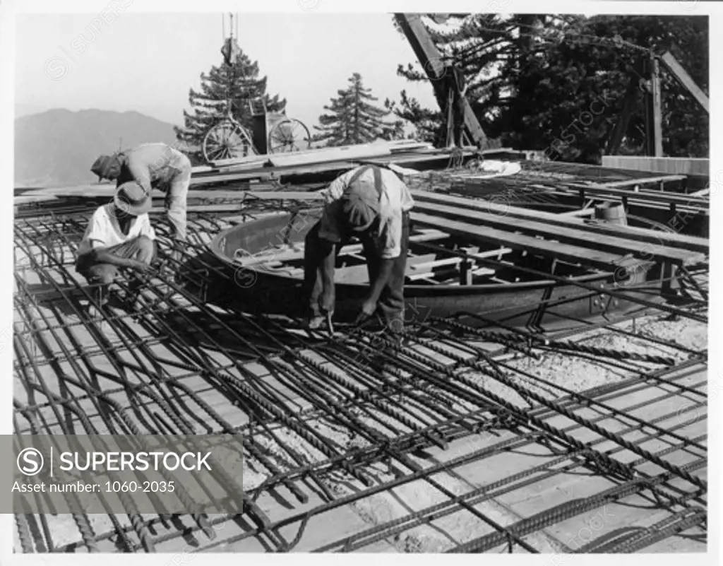 PUTTING IN THE REINFORCING RODS FOR THE CONCRETE FLOOR OF THE PIER OF THE HOOKER TELESCOPE.