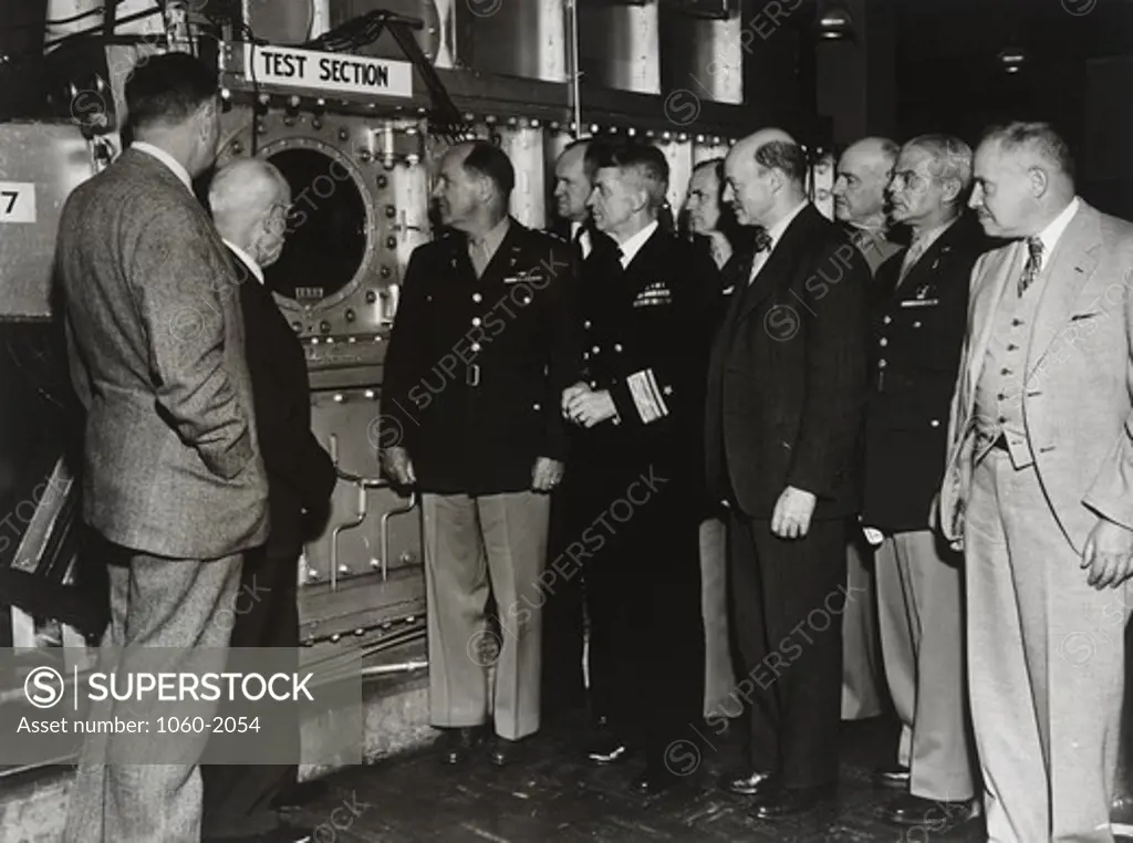 USA, Maryland, Aberdeen, Aberdeen Proving Ground, Ballistic Research Laboratory, Edwin Powell Hubble, Henry Stimson, General Harris, Colonel Eddy, RW Kent and other unidentified men witnessing test at supersonic wind tunnel