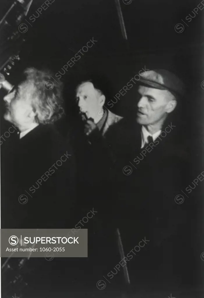 Albert Einstein, Edwin Powell Hubble, and Walter Sydney Adams at telescope