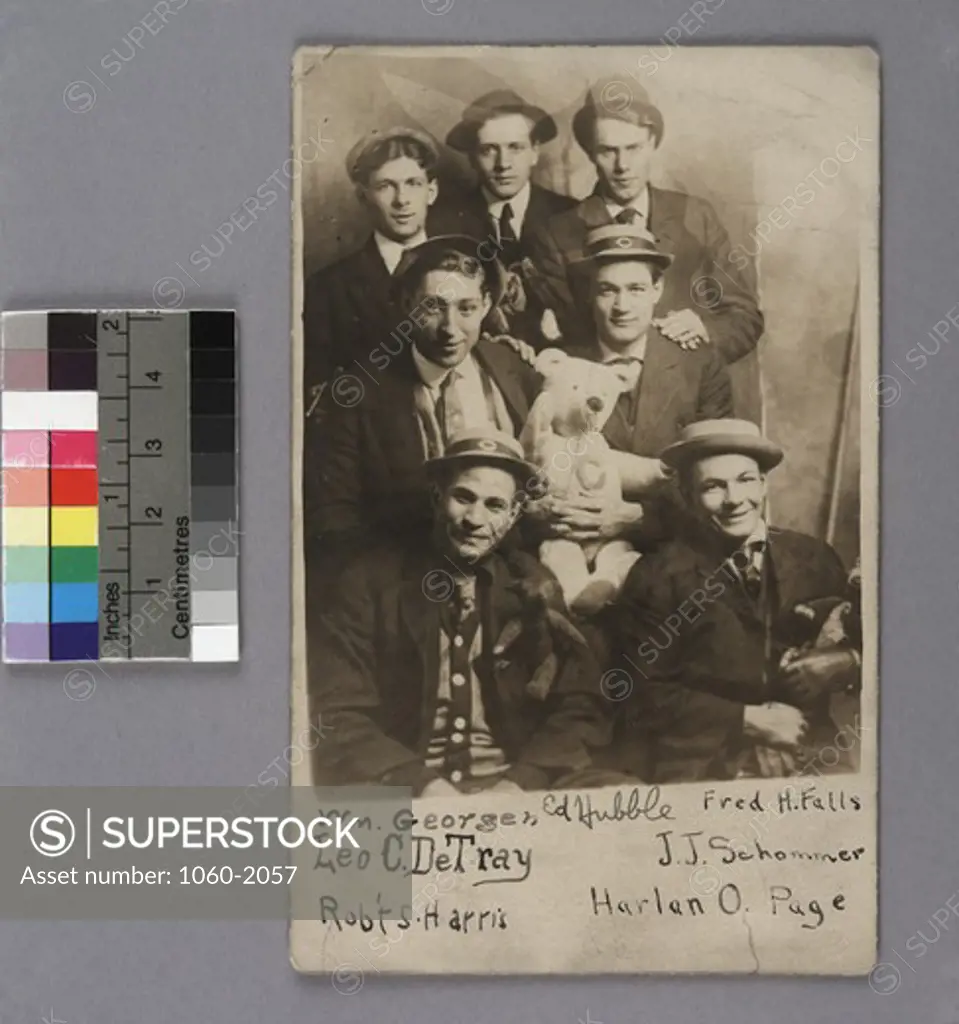 University of Chicago students, Edwin Powell Hubble (back row in center) and William Goergen, Leo C DeTray, Rovert Harris, J Schommer, and Harlan Page. Some men holding stuffed animals, including bear with C on chest