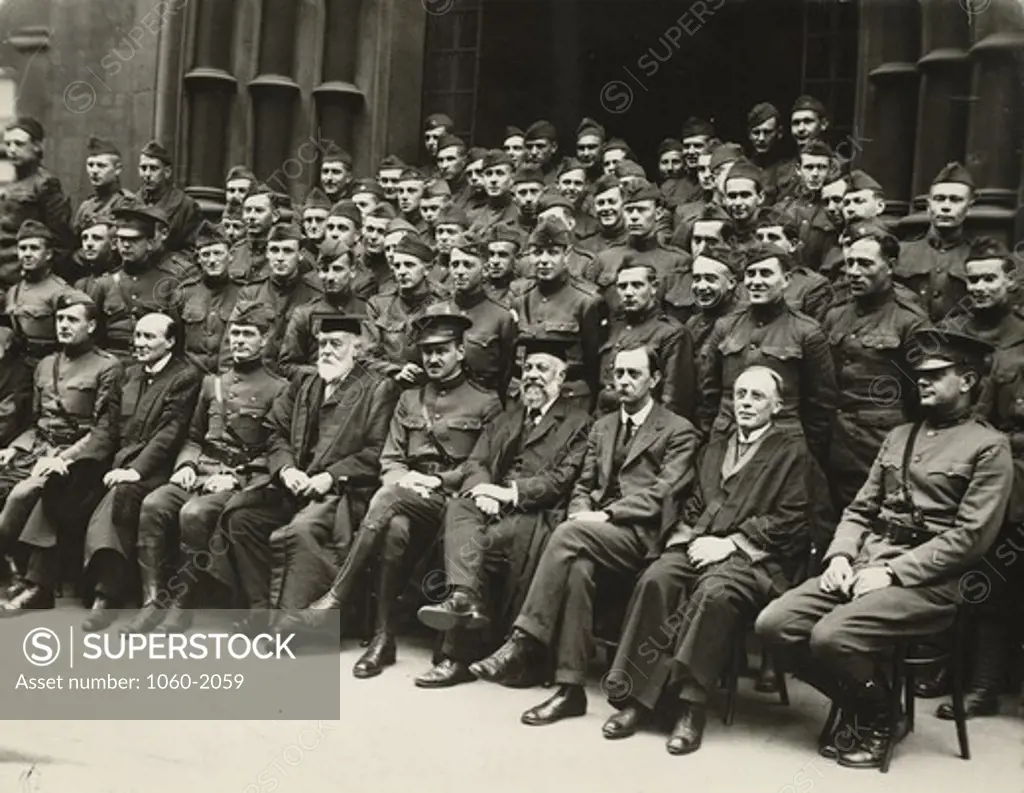 Major Edwin Hubble with other uniformed men and Birmingham University officials (World War I); front row, left to right: Hubble, Sir Charles Raymond Beazley, Colonel FF Longley, Sir Oliver Lodge, Captain Ralph R Faison, Sir William Ashley, Pawley (American Consul), Sir Charles Grant Robinson, and unidentified officer
