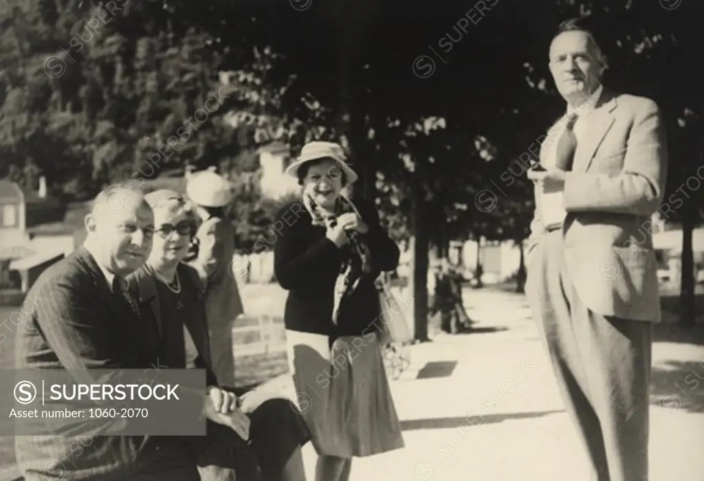 Robert Francis Gore-Browne, Agnes Margaret (Elieas) Gore-Browne, and Edwin Powell and Grace (Burke) Hubble outside in park setting