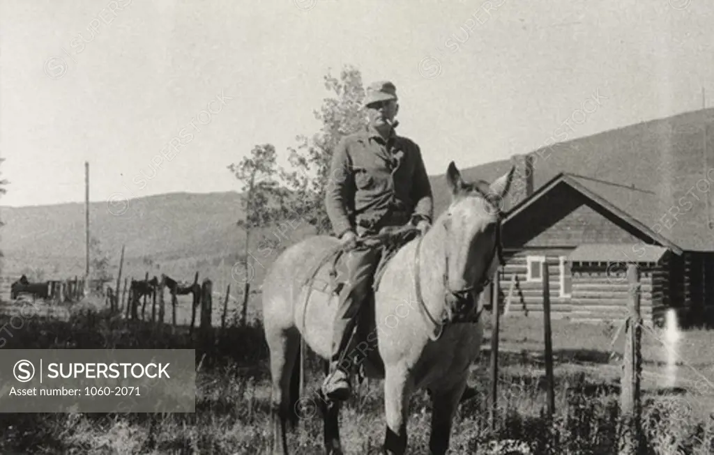 USA, Colorado, Rio Blanco Ranch, Edwin Powell Hubble on horse Buck
