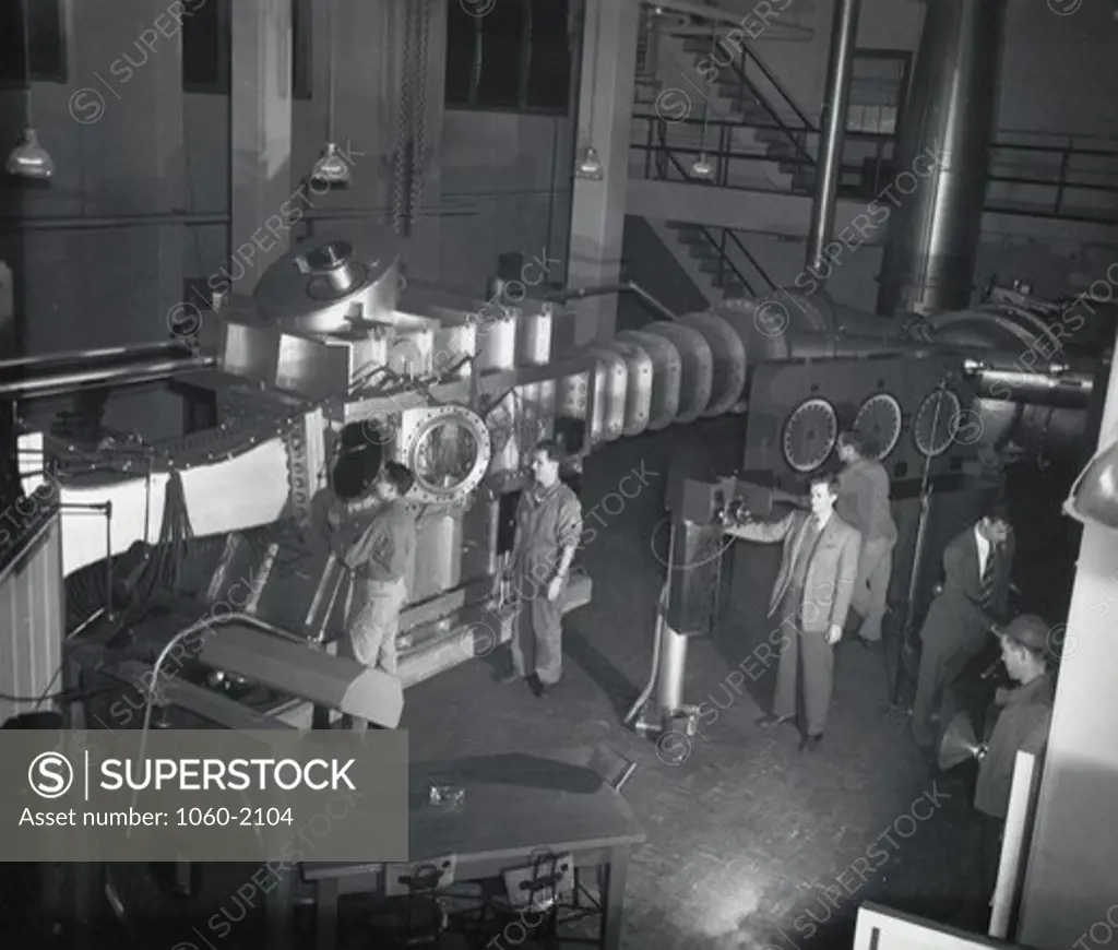 USA, Maryland, Aberdeen, Aberdeen Proving Ground, Ballistics Research Laboratory, Men working with supersonic wind tunnel