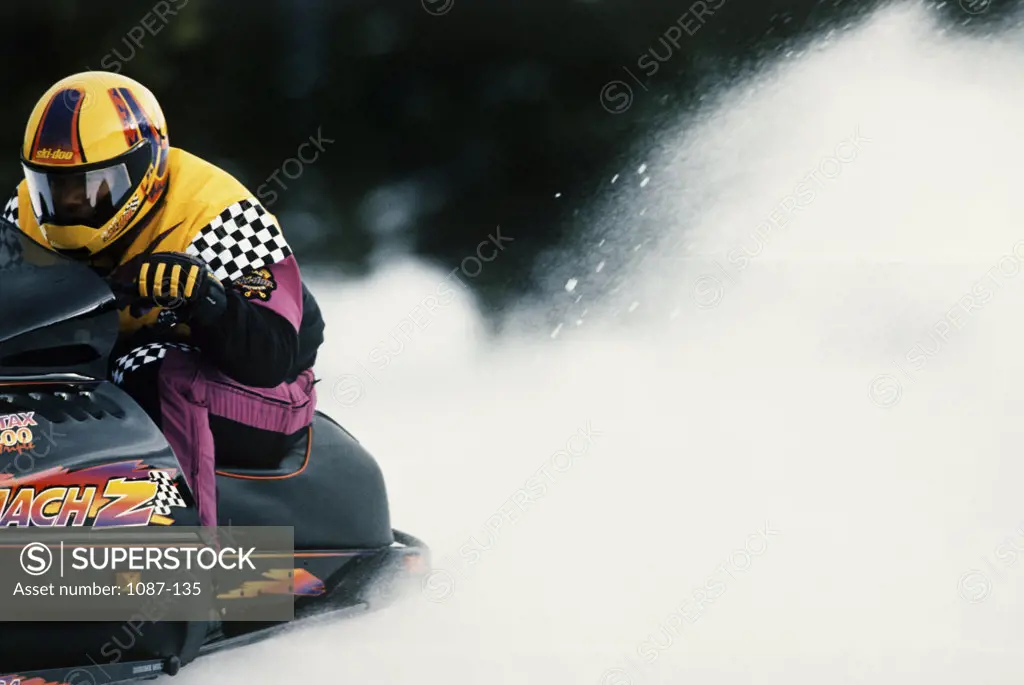 Man riding a snowmobile