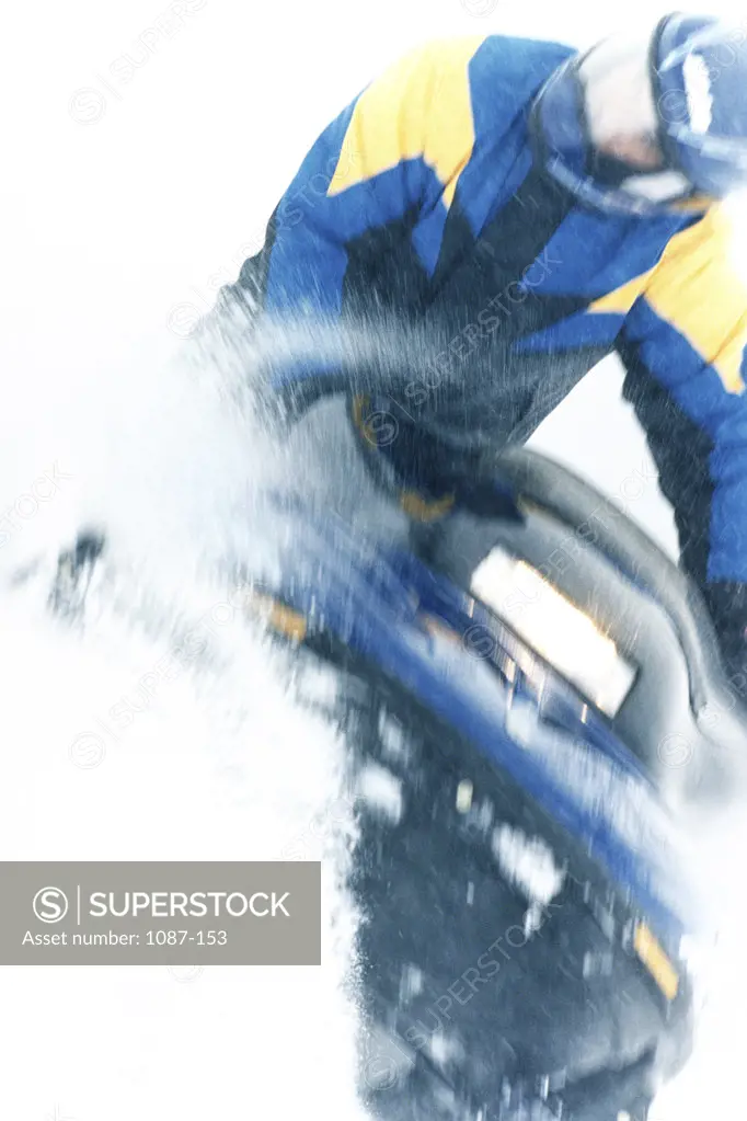 Low angle view of a person riding a snowmobile
