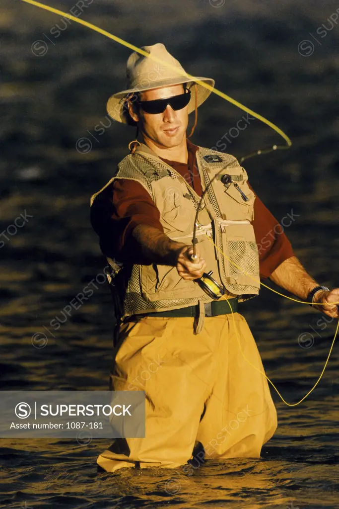 Close-up of a young man fly fishing