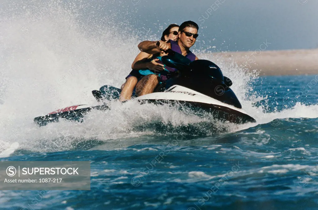 Young couple on a jet ski