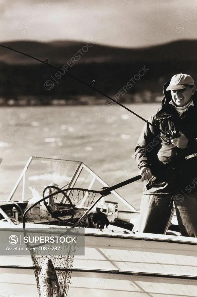 Mid adult man fishing in a river