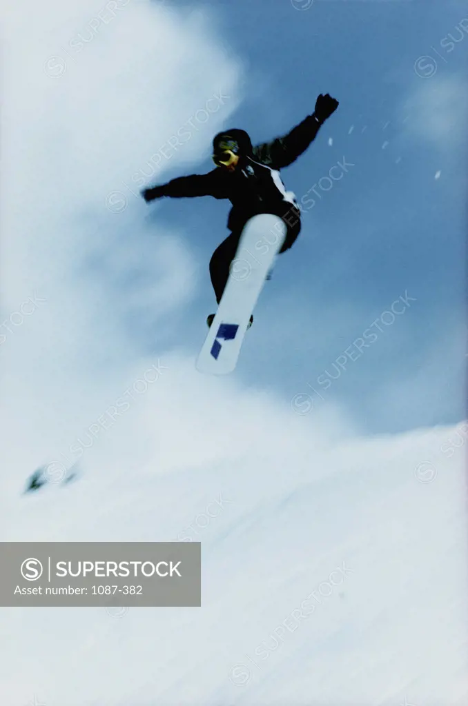 Low angle view of a person snowboarding