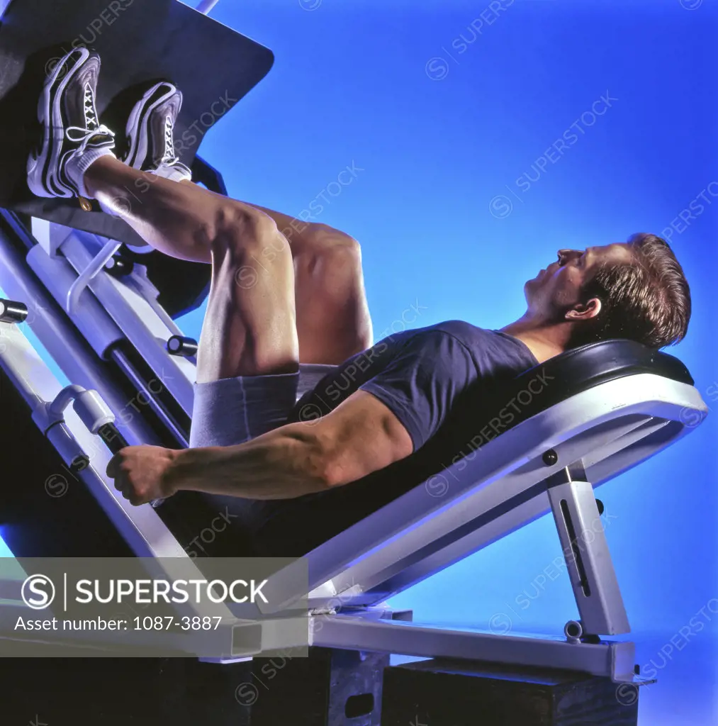 Young man exercising in a gym