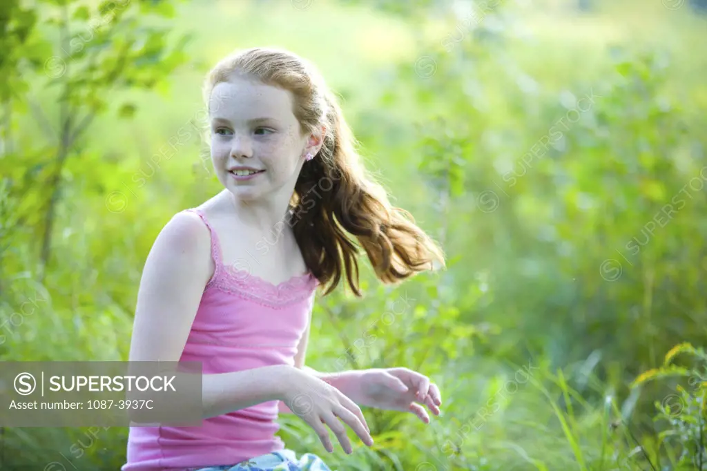 Girl playing in a field