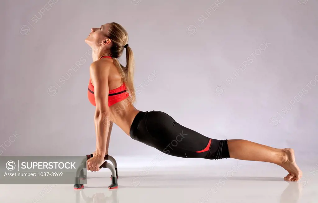 Studio shot of exercising woman