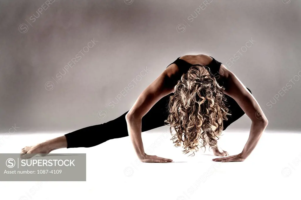 Studio shot of woman exercising