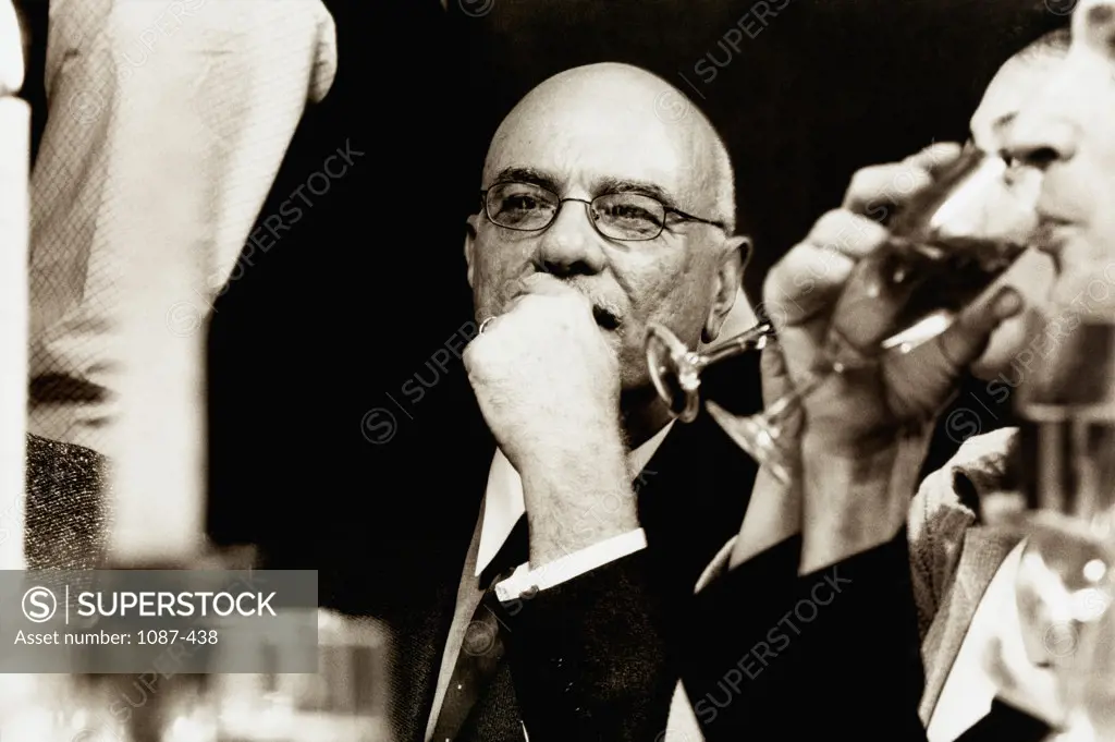 Close-up of three businessmen drinking champagne