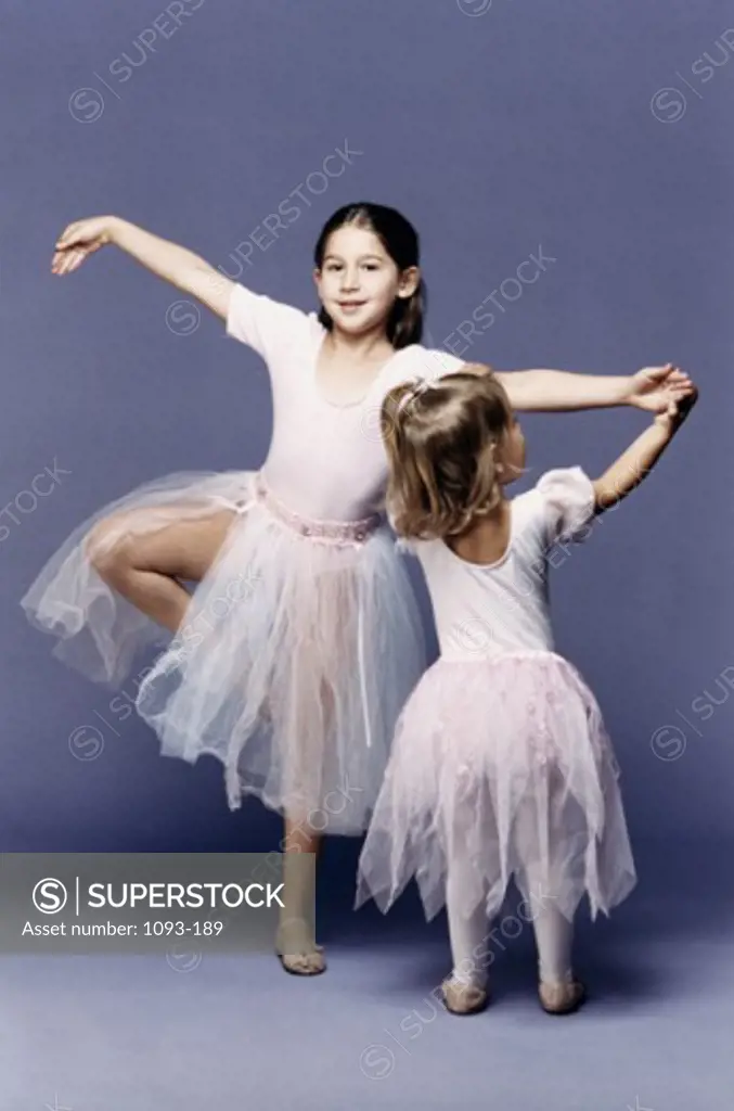 Portrait of a girl dancing with her sister