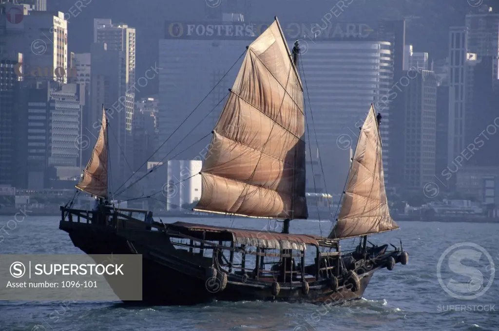 Chinese Junk sailing in the sea, Hong Kong Harbor, Hong Kong, China