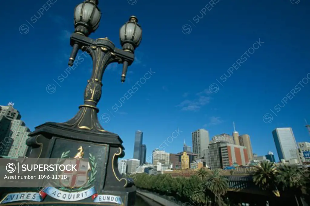 Low angle view of a lamppost in front of buildings, Melbourne, Victoria, Australia